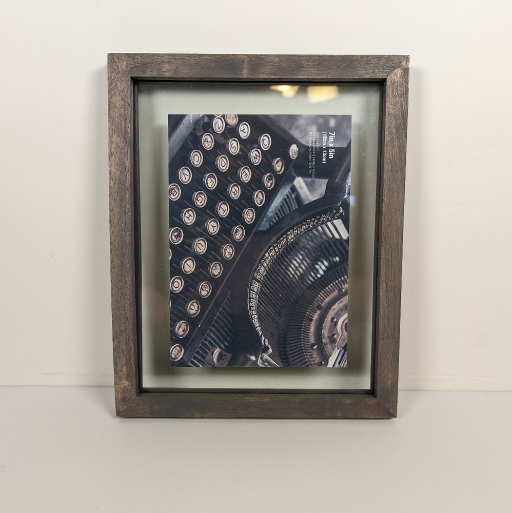Picture Frame in grayish color and it's 7in × 5in.